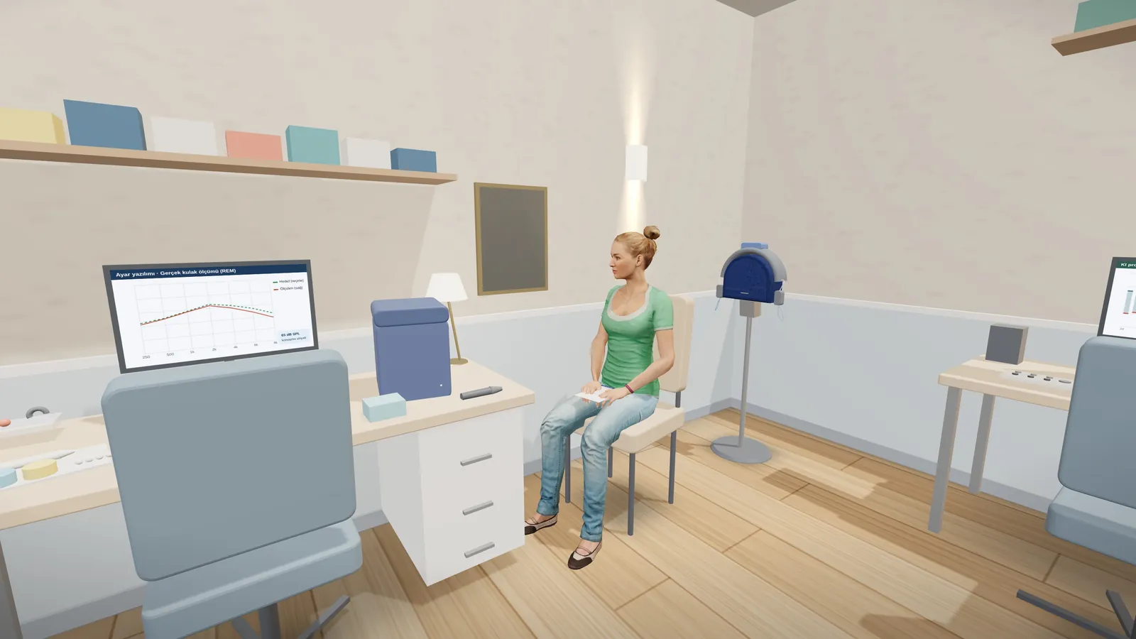 Fitting room: hearing aid desk, real-ear measurement loudspeaker and the patient in the chair.